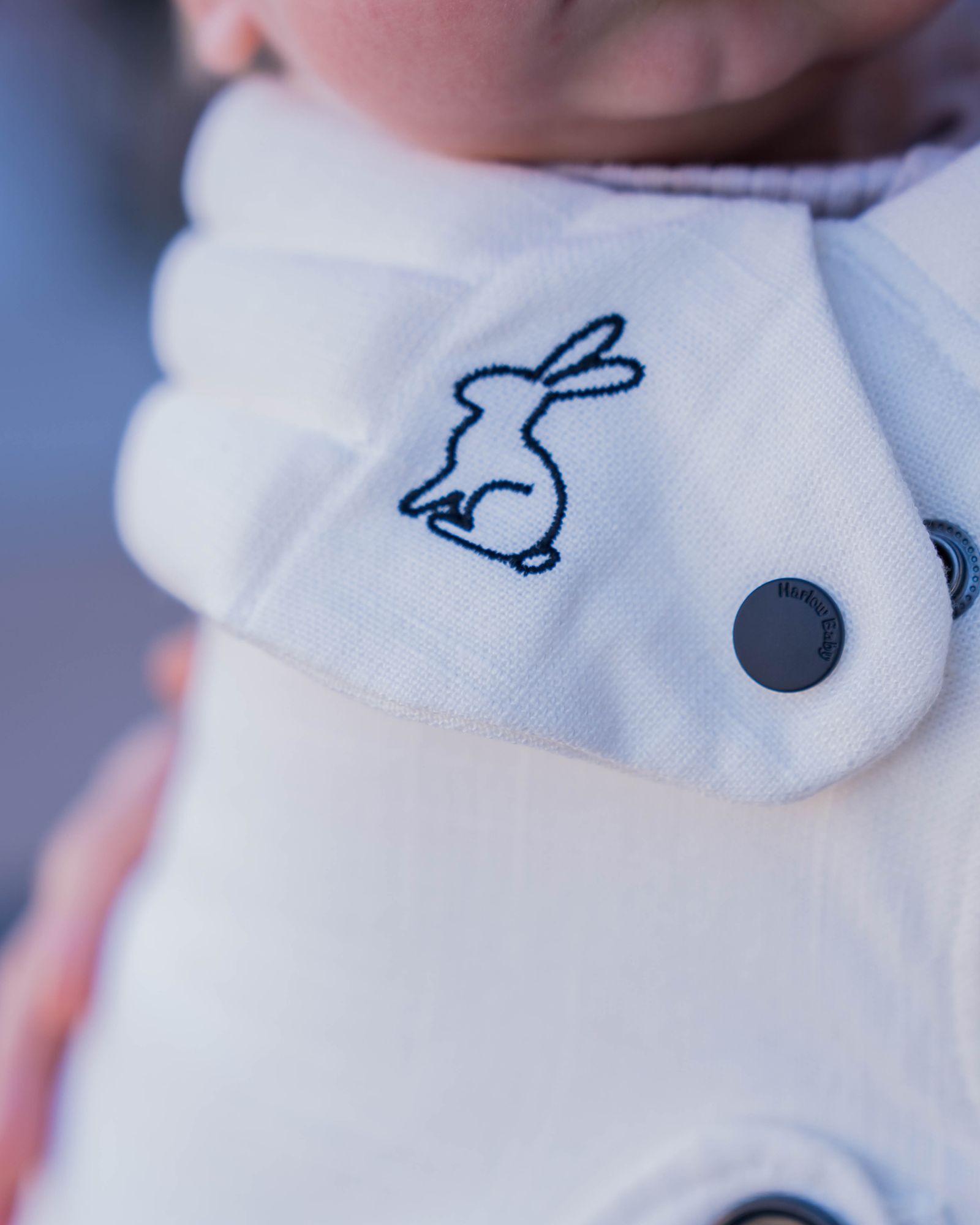 cream ergonomic baby carrier close up view