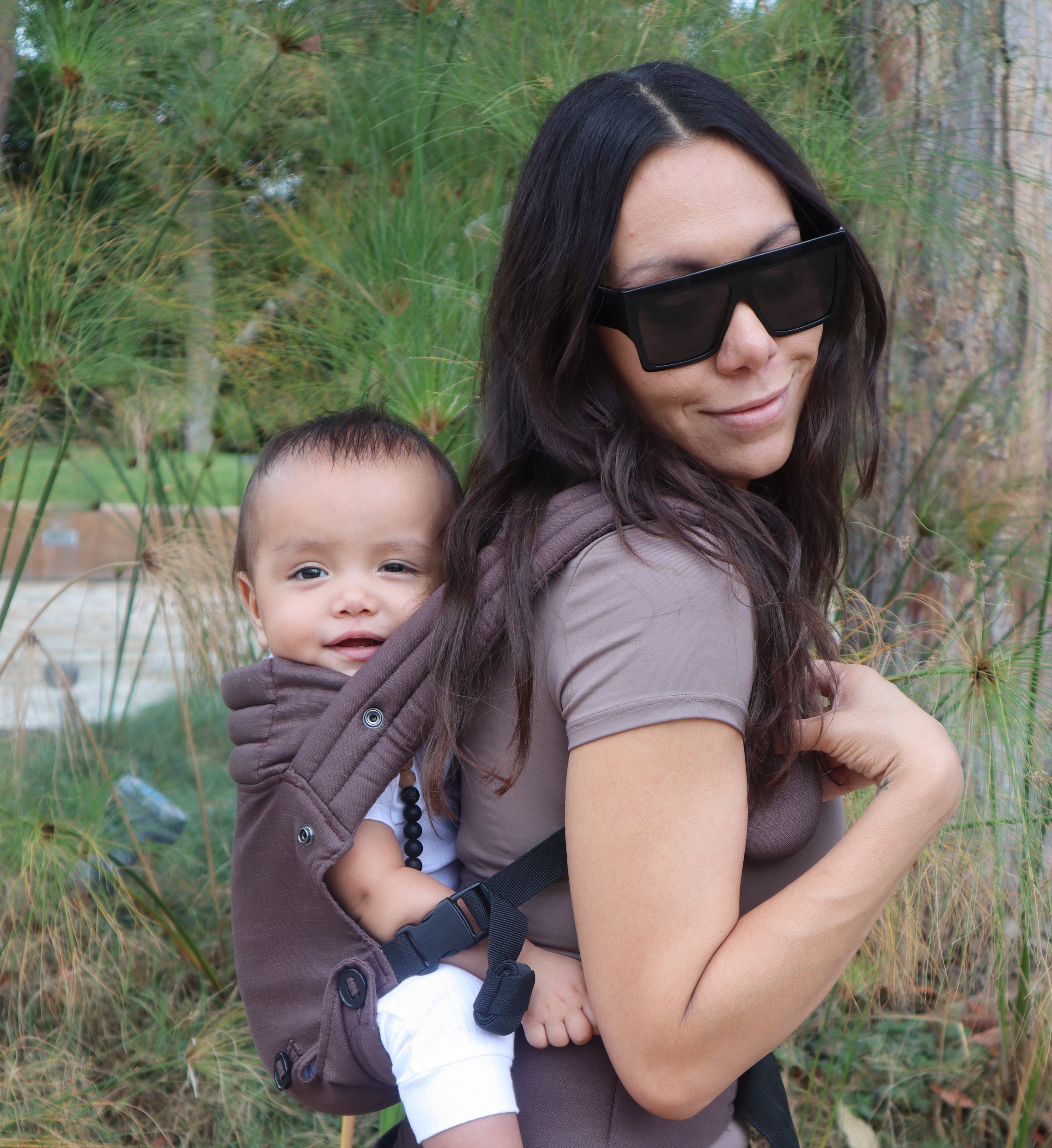 Brown baby carrier with back carry position