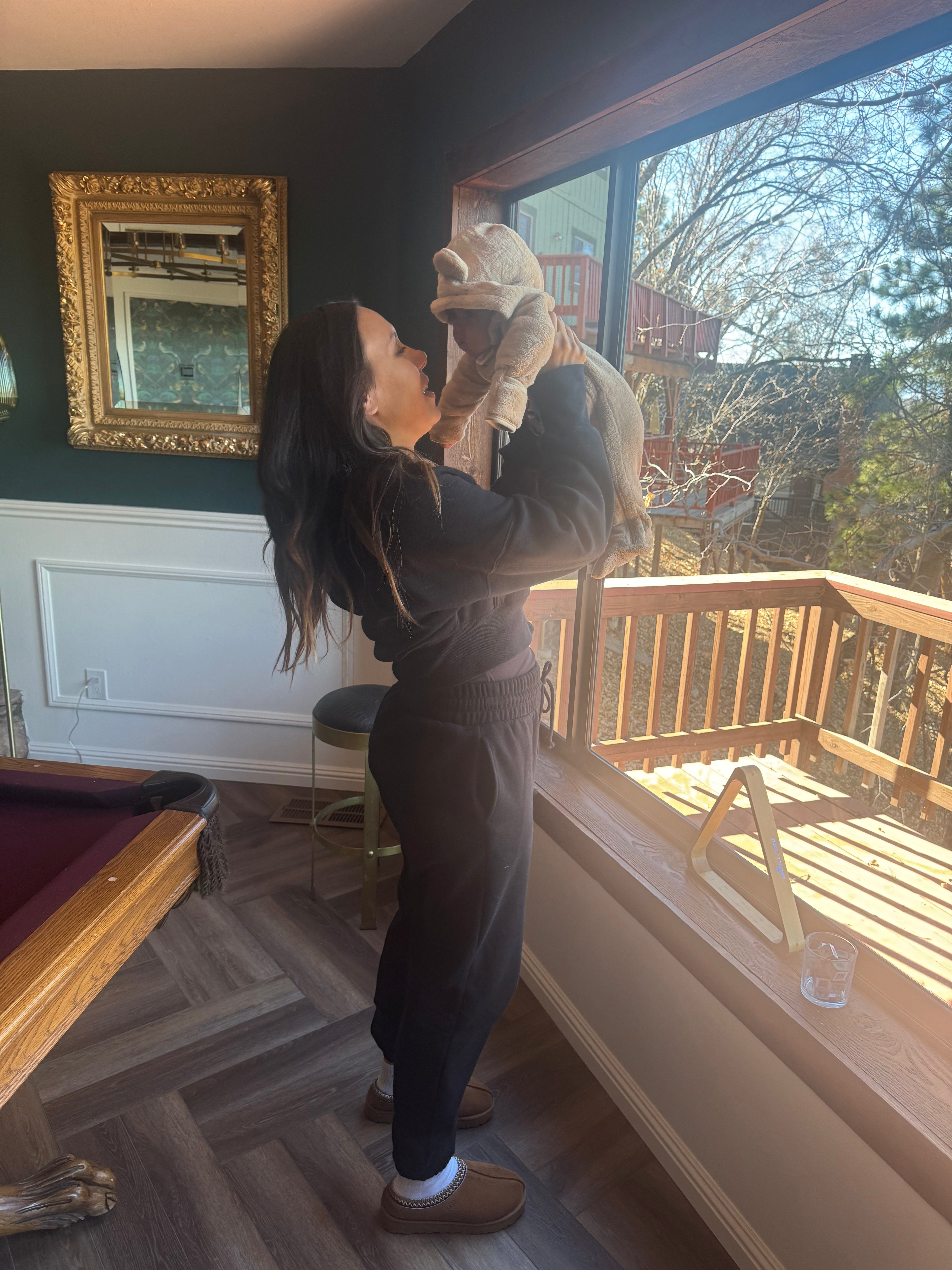 Harlow Baby founder Alyce holding her baby before starting Harlow Baby