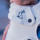 cream ergonomic baby carrier close up view