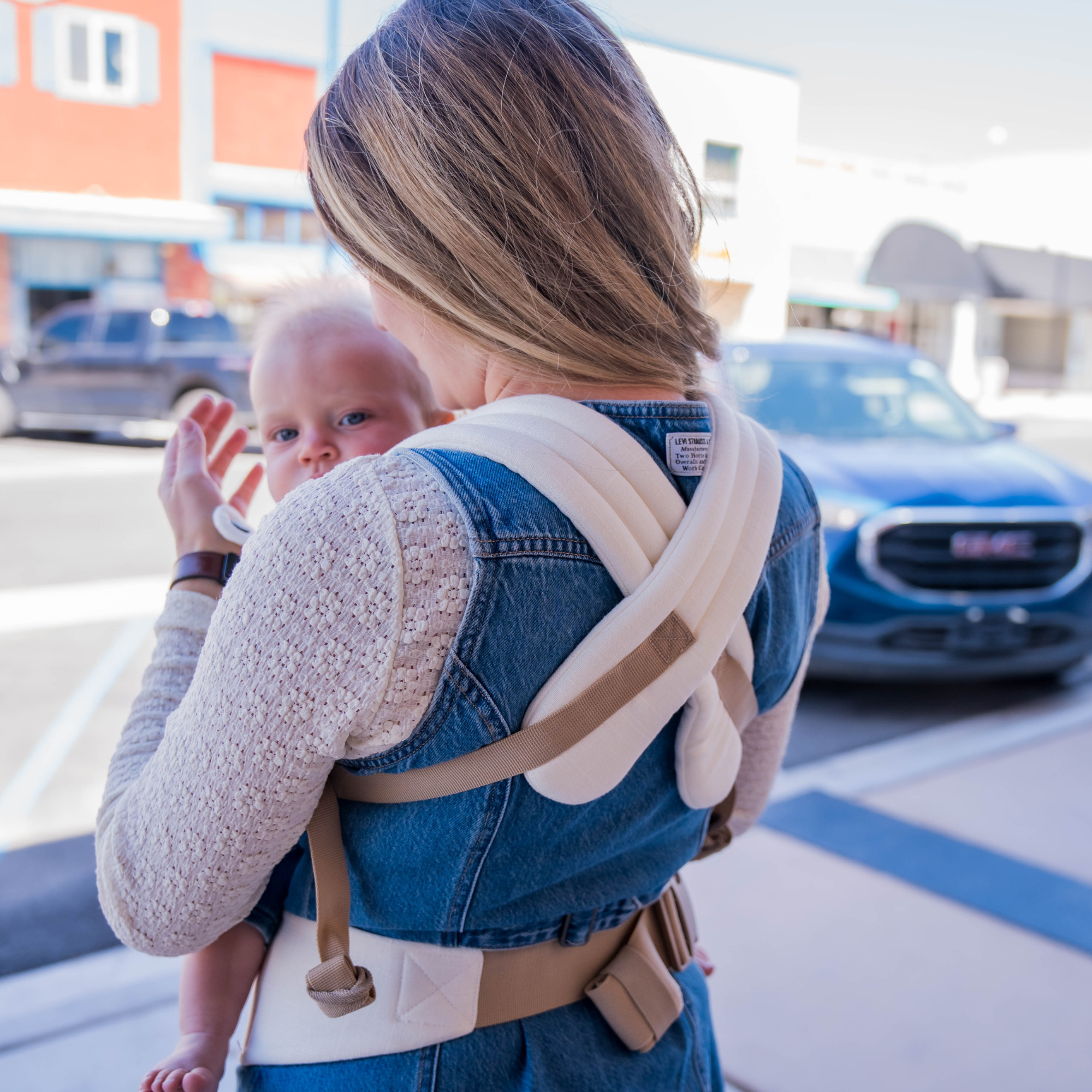 cream ergonomic baby carrier back view